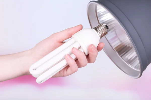 Hand changing light bulb for lamp at home — Stock Photo, Image