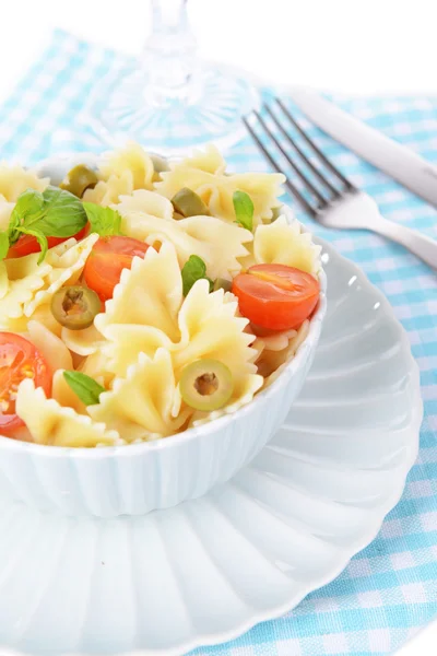 Delicious pasta with tomatoes on plate on table close-up — Stock Photo, Image