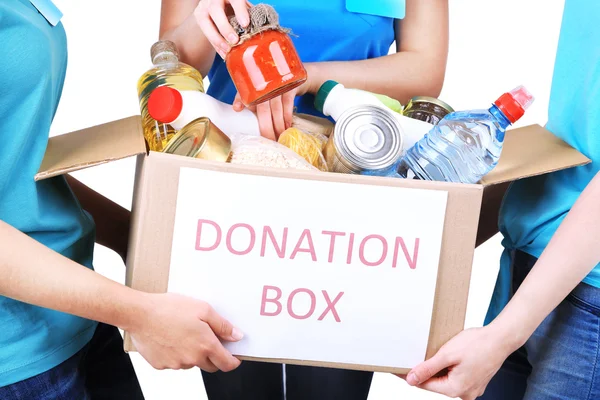 Volunteers with donation box with foodstuffs — Stock Photo, Image