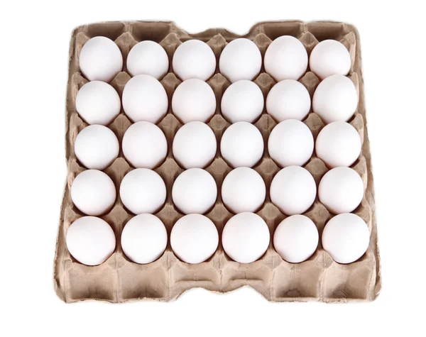 Eggs in paper tray isolated on white — Stock Photo, Image