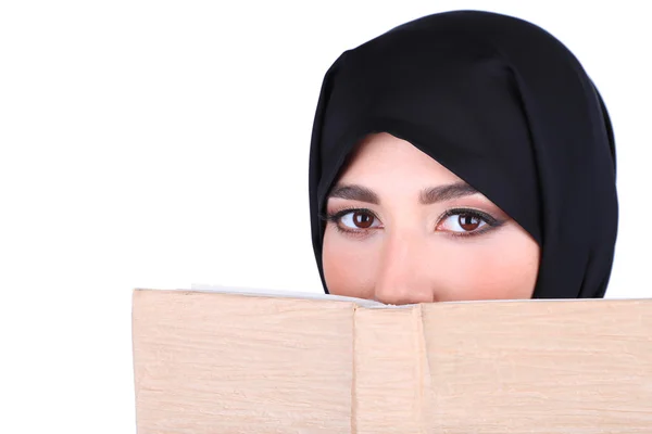 Beautiful muslim arabic woman with book on grey background — Stock Photo, Image