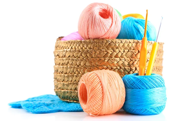 Colorful yarn for knitting with napkin in wicker basket and crochet hook, isolated on white — Stock Photo, Image