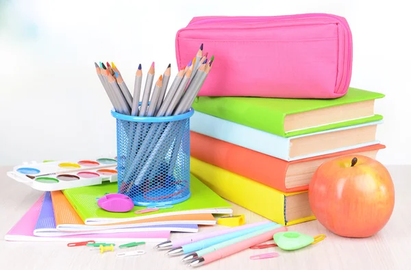 Bright school supplies on table on light background — Stock Photo, Image