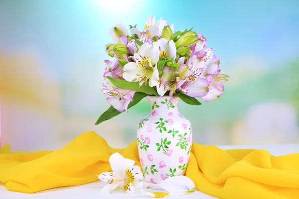 Bouquet of freesias in vase on table on natural background — Stock Photo, Image