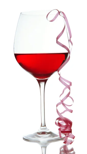 Glass of red wine and streamer after party isolated on white — Stock Photo, Image