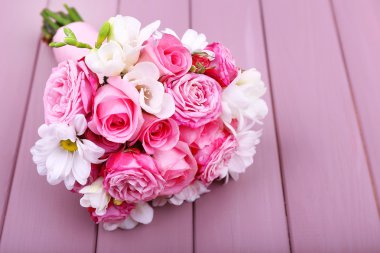 Beautiful wedding bouquet on wooden background clipart