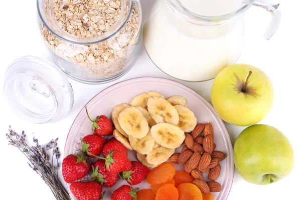 Healthy cereal with milk and fruits close up — Stock Photo, Image