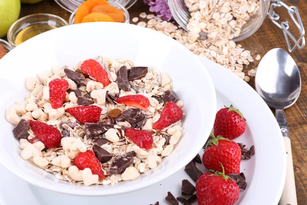 Healthy cereal with fruits on wooden table — Stock Photo, Image