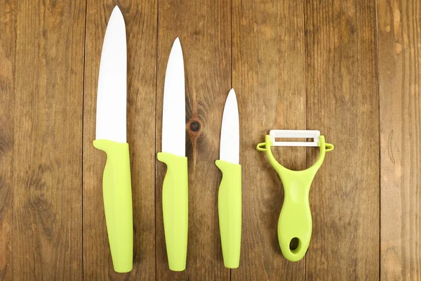 Kitchen knives on wooden table — Stock Photo, Image