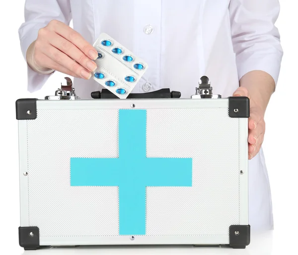 Nurse holding first aid kit, isolated on white — Stock Photo, Image