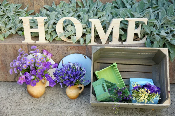 Garden decoration with wildflowers and decorative letters, outdoors — Stock Photo, Image