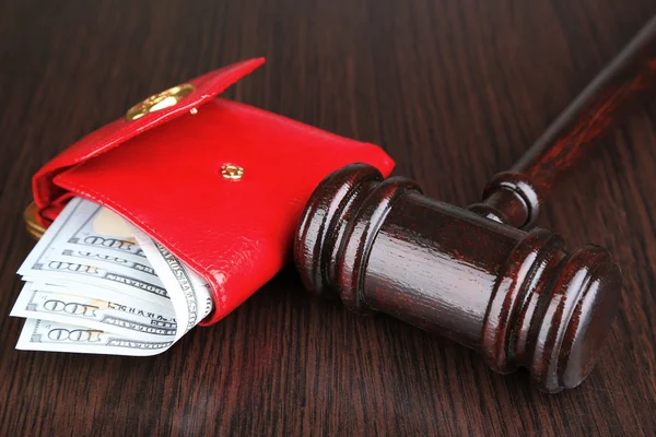 Gavel and money in wallet on wooden background — Stock Photo, Image