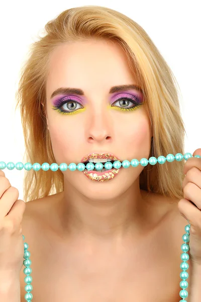 Beautiful woman with bright make-up and beads in teeth, close up — Stock Photo, Image