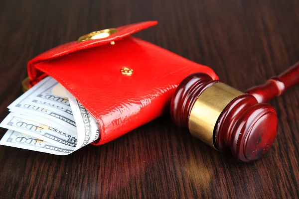 Gavel and money in wallet on wooden background — Stock Photo, Image