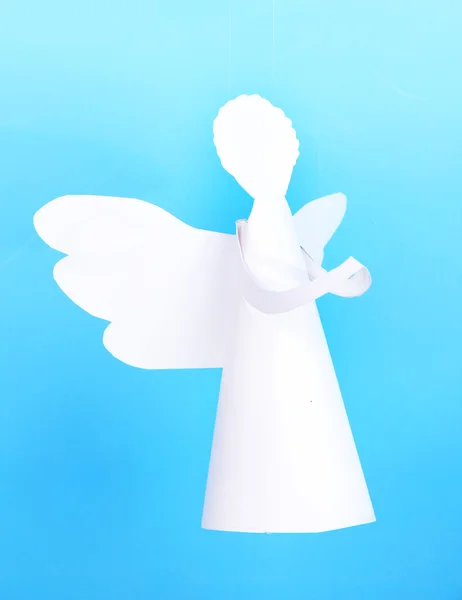 Christmas angel on light blue background — Stock Photo, Image