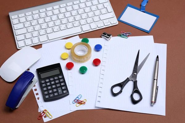 Office table with stationery accessories, keyboard and paper, close up — Stock Photo, Image