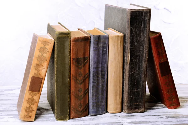 Old books on table on grey background — Stock Photo, Image