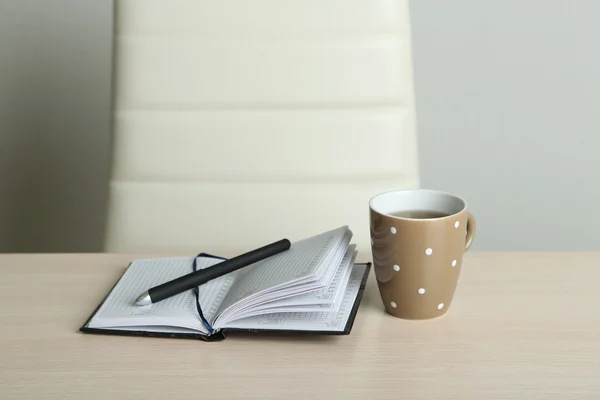 Empty workplace in office on gray background — Stock Photo, Image