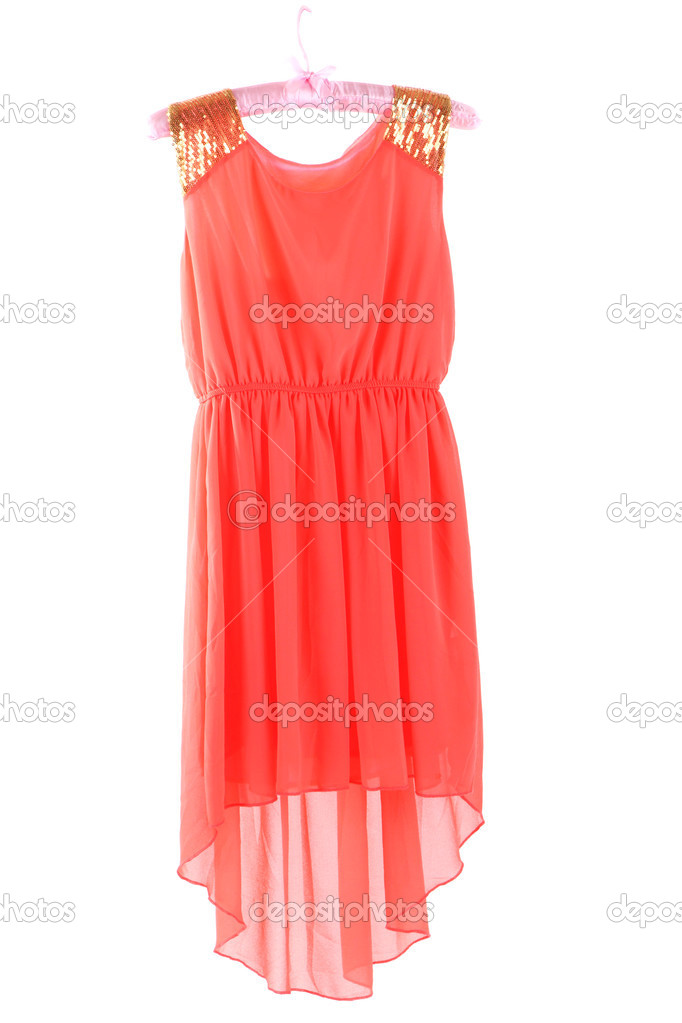 Beautiful coral dress hanging on hangers isolated on white