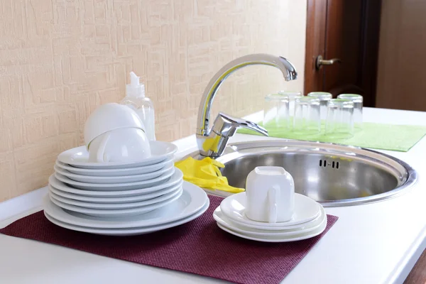 Dishes drying near  metal sink — Stock Photo, Image