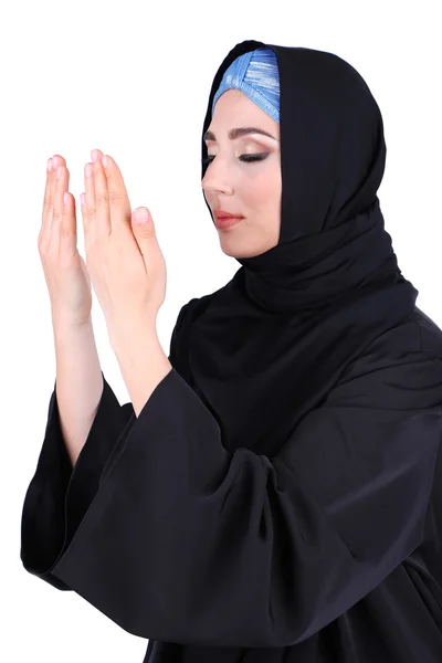 Schöne muslimische arabische Frau betet auf grauem Hintergrund — Stockfoto