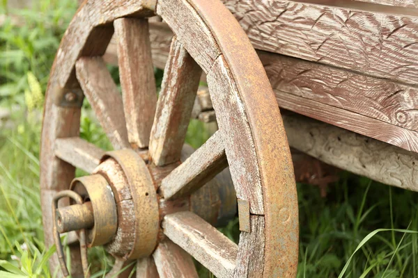 Old retro wheel on trolley, outdoors — Stock Photo, Image