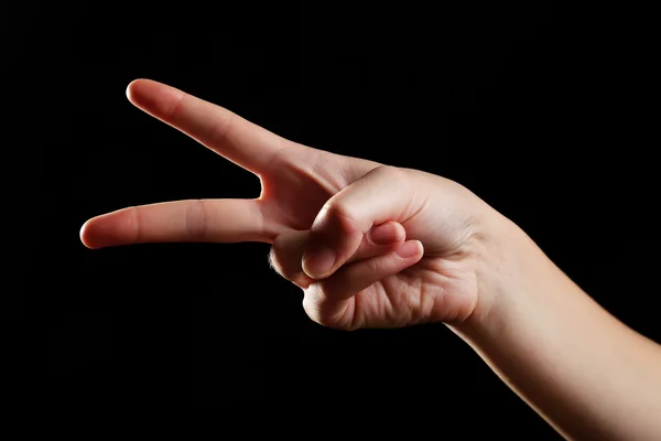 Human hand on black background — Stock Photo, Image