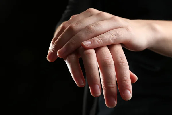 Human hands on black background — Stock Photo, Image