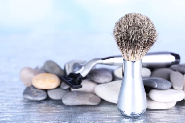 Shaving accessories on stones on bright background — Stock Photo, Image