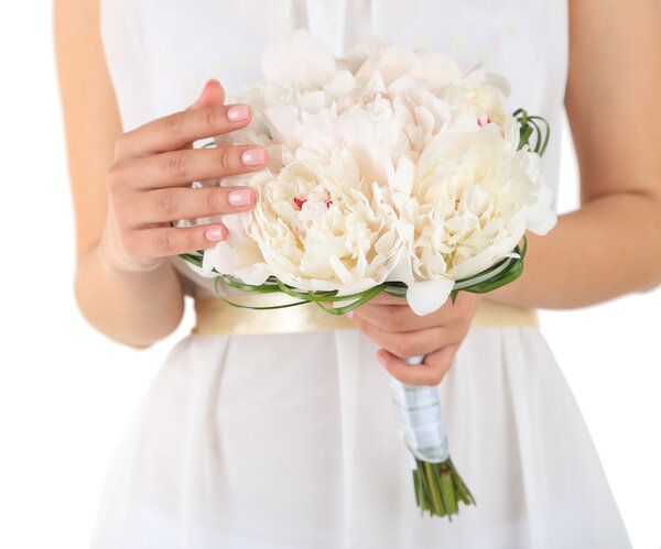 Bride holding wedding bouquet of white peonies, close-up, isolated on white