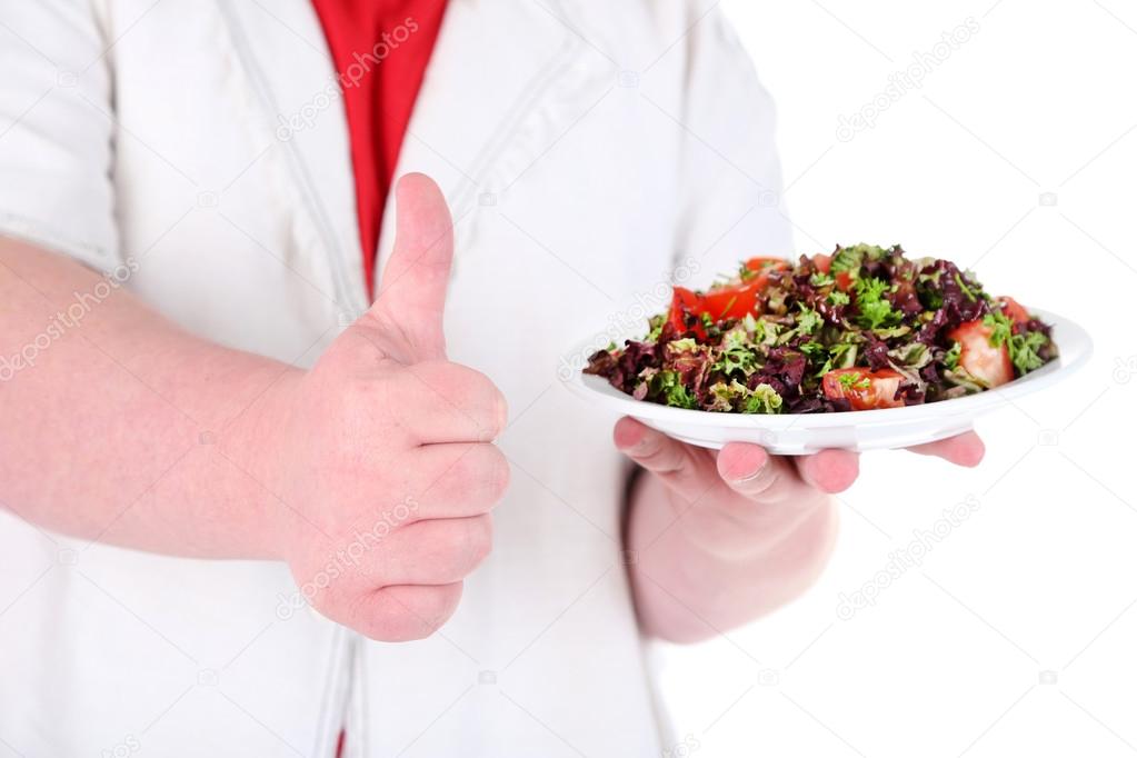 Fat man  with wine glass and vegetable salad, isolated on white