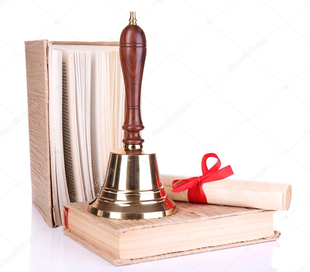 Gold retro school bell with scroll and books isolated on white