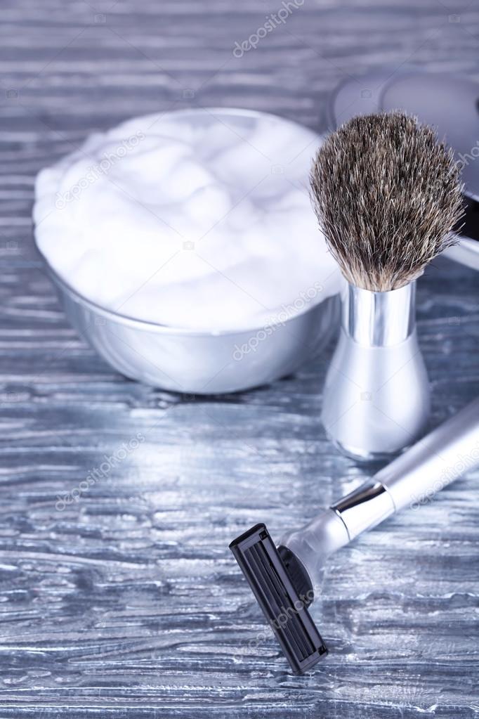 Shaving accessories on gray background