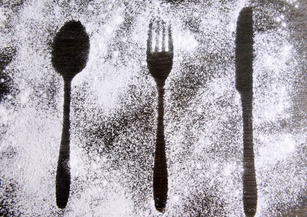 Imprint of cutlery  made of flour on table close-up — Stock Photo, Image