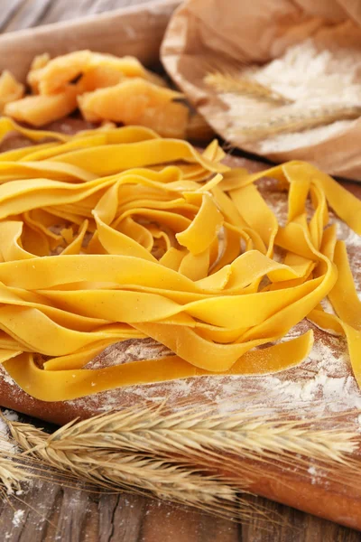 Still life with raw homemade pasta and ingredients for pasta — Stock Photo, Image