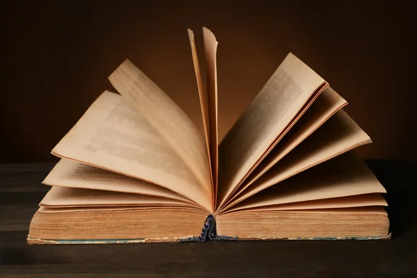 Old book on table on brown background — Stock Photo, Image