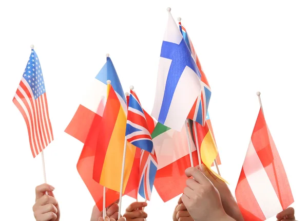 Beyaz izole farklı bayrak tutan eller — Stok fotoğraf