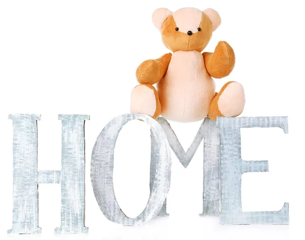Decorative letters forming word HOME with teddy bear isolated on white — Stock Photo, Image