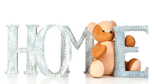 Decorative letters forming word HOME with teddy bear isolated on white — Stock Photo, Image