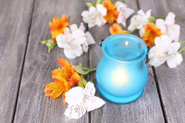 Bright icon-lamp with flowers on wooden background — Stock Photo, Image