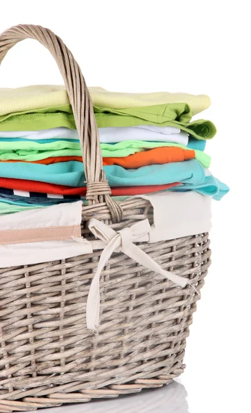 Bright clothes in laundry basket, isolated on white — Stock Photo, Image