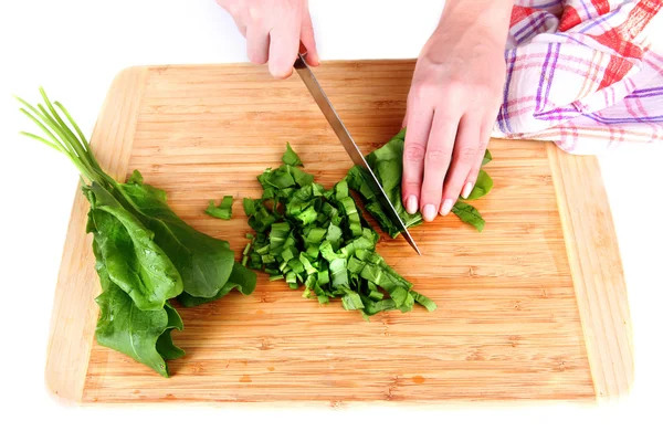 Female hand cutting greens on cutting board isolated on white — Stock Photo, Image