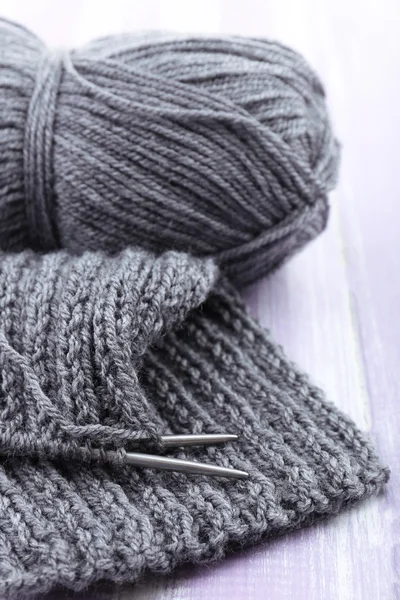 Knitting with spokes on wooden background — Stock Photo, Image