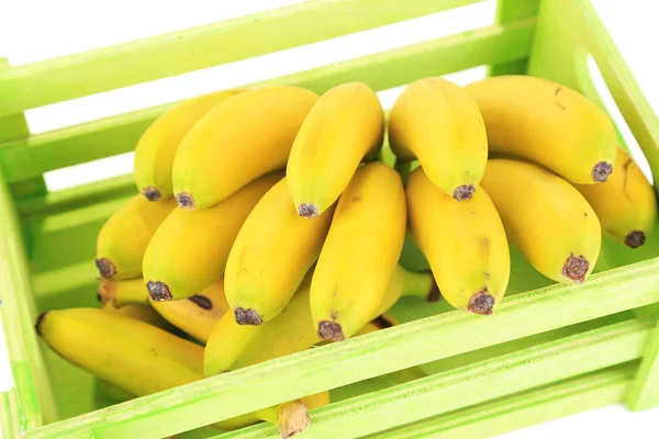 Bunch of mini bananas in wooden box isolated on white — Stock Photo, Image