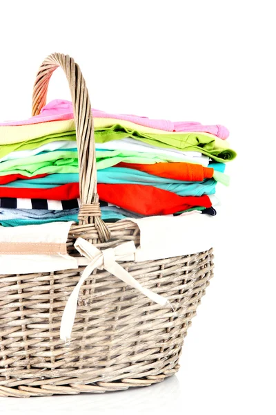 Bright clothes in laundry basket, isolated on white — Stock Photo, Image