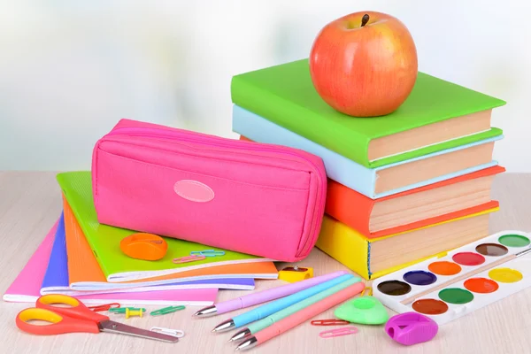 Bright school supplies on table on light background — Stock Photo, Image