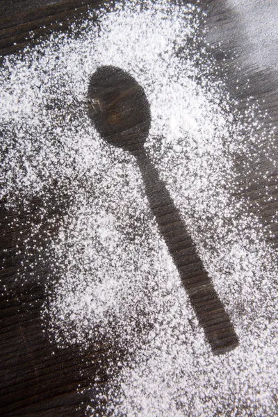Imprint spoon made of flour on table close-up — Stock Photo, Image