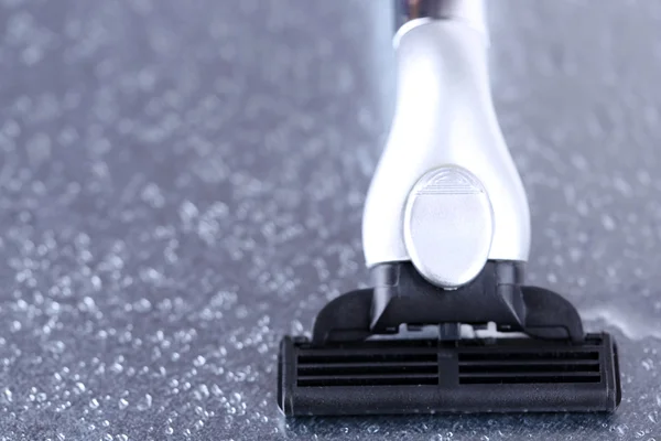 Shaving razor on gray background — Stock Photo, Image