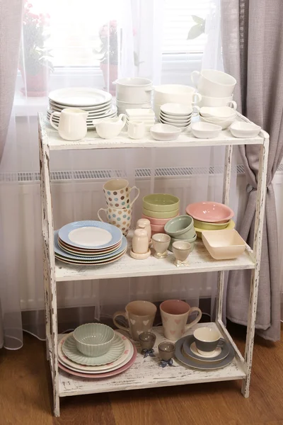 Different tableware on shelf in the interior — Stock Photo, Image