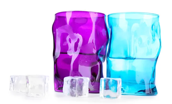 Colorful glasses and ice cubes isolated on white — Stock Photo, Image